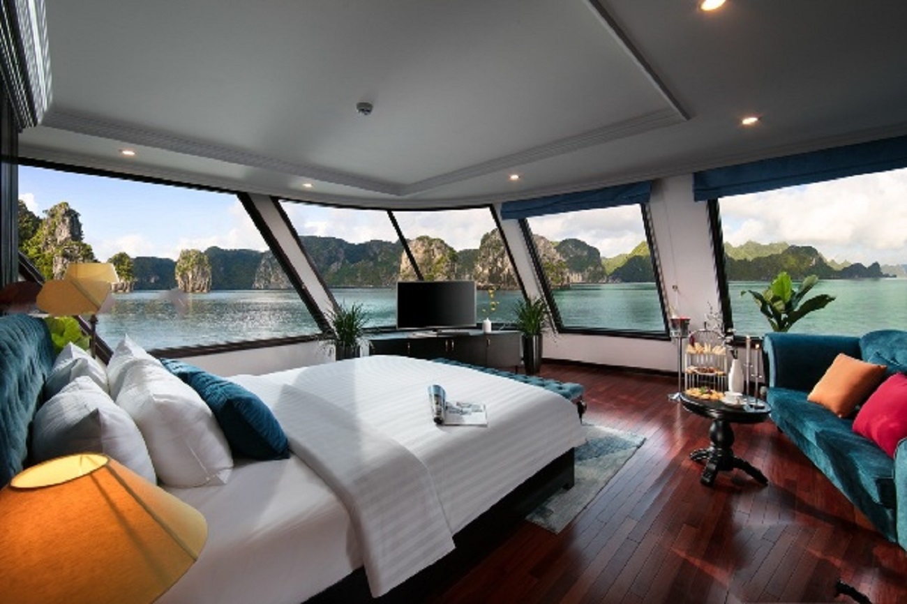 Stunning view from a balcony cabin on a 5-star cruise in Halong Bay and Lan Ha Bay, showcasing luxury and breathtaking scenery